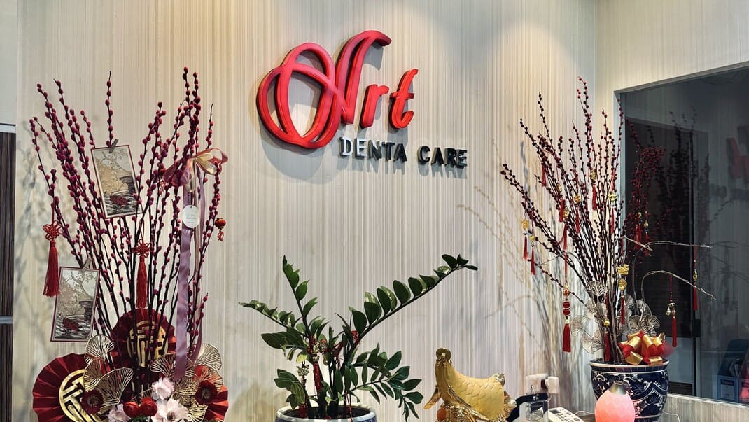 Art Denta Care reception — the 3D brand sign in the clinic lobby