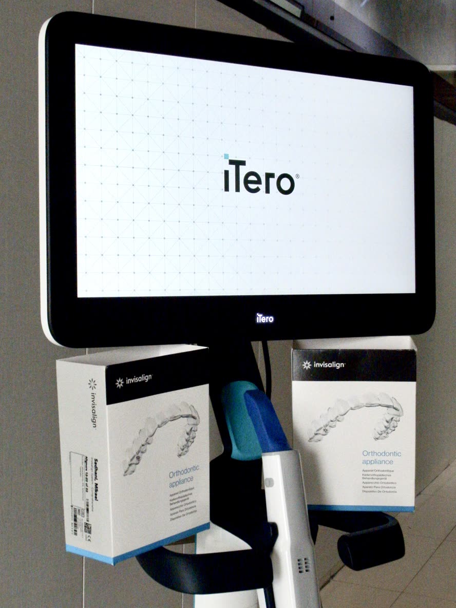 iTero digital scanner and Invisalign clear aligner boxes at Art Denta Care